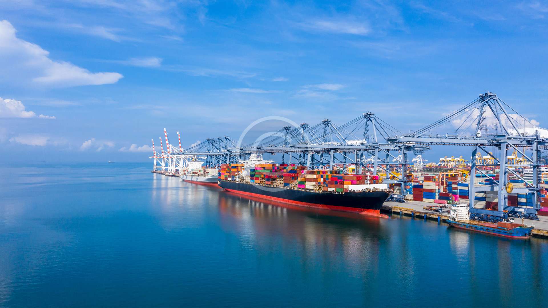 Container ship at industrial port in import export global business logistic and transportation, Container ship loading and unloading freight shipment, Aerial view container cargo boat freight ship.